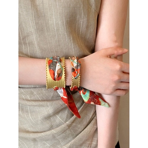 Vintage matte gold hollow cuff bracelet with red and green floral print silk scarf detail