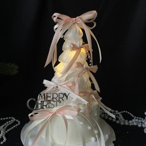 Exquisite white Christmas tree cake topper with pink bows, pearls and glowing LED lights