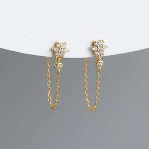 Elegant gold flower stud earrings with sparkling cubic zirconia and dangling tassel chains
