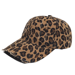 Detailed side view of leopard print baseball cap featuring vintage distressed torn effects