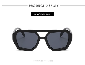 Front view of black geometric oversized sunglasses with stylish double bridge design