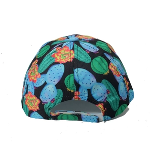 Detail view of the cactus pattern fabric and adjustable velcro strap on the baseball cap