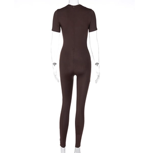 Rear view detail of brown short sleeve yoga jumpsuit with hidden back zipper