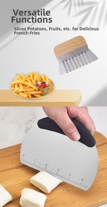Detail of stainless steel dough scraper with scale and wavy potato cutter with wooden handle
