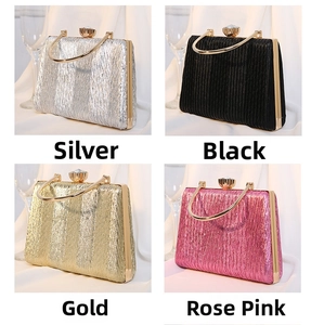 Detail of elegant pleated evening clutch bags in silver, black, gold and rose pink colors