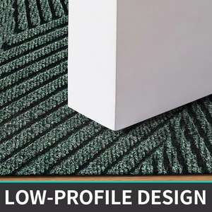 Close-up of dark green low-profile PVC floor mat showing slim design and textured surface