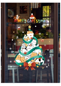 Macro view of Christmas window sticker featuring cartoon cats and dogs on glass door