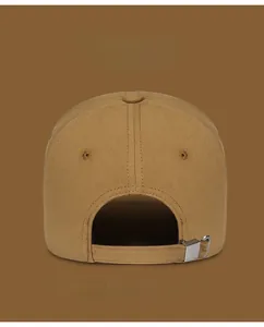 Detail of adjustable metal buckle and strap on the back of embroidered baseball cap