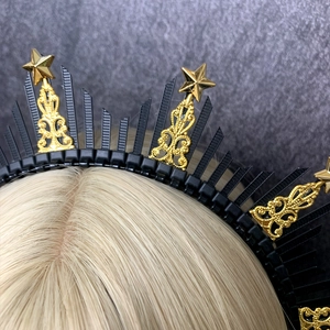 Gothic black and gold halo crown featuring pointed spikes and metallic stars headpiece