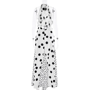 Back view of a white polka dot maxi dress with halter neck and open back on a mannequin