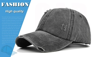 Detailed close-up of distressed denim baseball cap with torn fabric and embroidered M logo