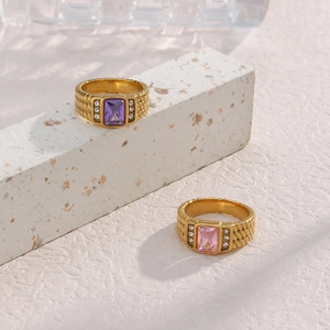 Detail of 18K gold plated woven rings with purple and pink rectangular zircon stones