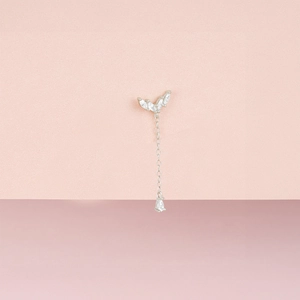 Macro detail of S925 sterling silver ear cuff featuring marquise cut zircon and chain drop
