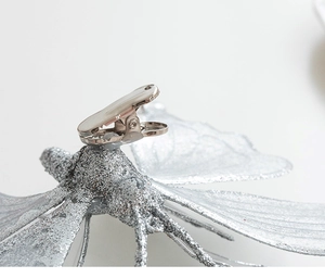 Detailed macro view of 25cm silver glitter butterfly ornament with metal clip