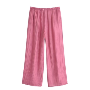 Detail of pink pleated wide-leg trousers with elastic high waist and vertical texture