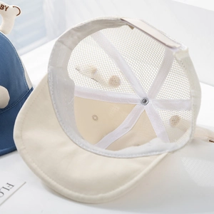 Detailed interior of baby sun hat showing breathable mesh and soft sweatband