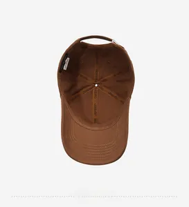 Detailed view of internal sweatband and reinforced stitching on a cotton baseball cap