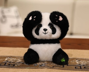 Detailed plush panda doll with soft faux fur and pink heart embroidery on paws