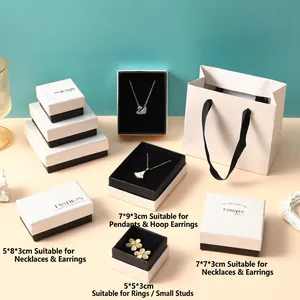 Pink jewelry gift box set with matching paper bags for rings and necklace packaging