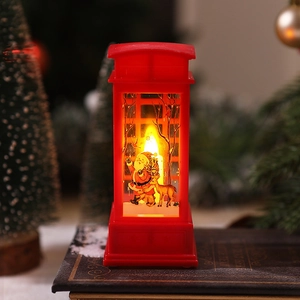 Close-up of red Christmas telephone booth lantern with Santa Claus and warm LED lighting