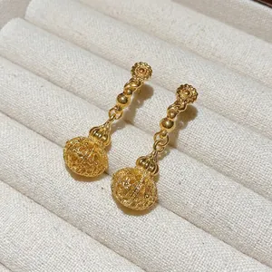 French palace style golden hollow lantern earrings with silver needles for women