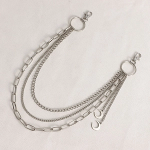 Silver multilayer metal waist chain detail with crescent moon pendants and lobster clasps