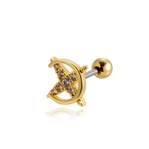 Detail view of gold crescent moon and cross ear stud with sparkling crystals