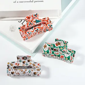 Three-piece Christmas themed hair claw clips set with festive reindeer and tree patterns