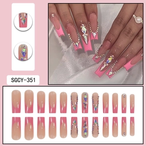 Long nude press-on nails with pink French tips and sparkling rhinestone geometric accents