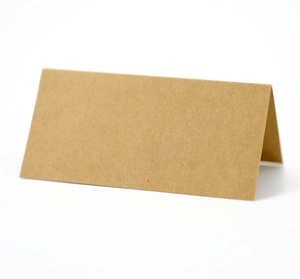 Macro detail of foldable kraft paper table card with natural wood texture on white base