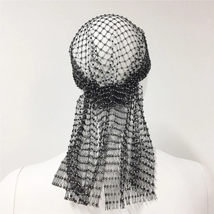 Detailed back view of black mesh rhinestone headpiece with sparkling crystals and long veil