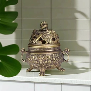 Antique brass incense burner with Nine Dragon relief and hollow lid for home decor