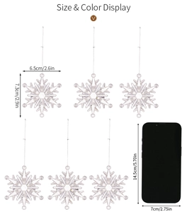 Detailed size chart showing transparent acrylic snowflake ornaments with smartphone reference