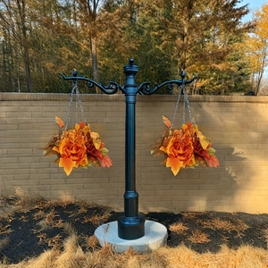 Outdoor iron garden hanging bracket with autumn harvest floral baskets and orange peonies