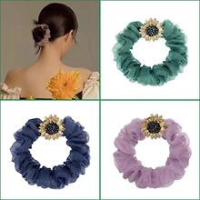 Detail of lace bow hair scrunchies with sunflower decor in green, blue and pink