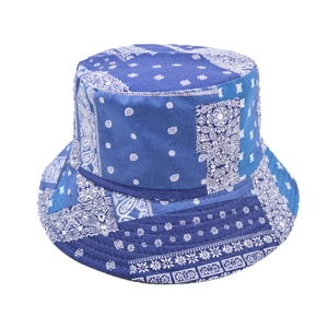 Detail of navy paisley bucket hat featuring reinforced brim stitching and cotton canvas fabric