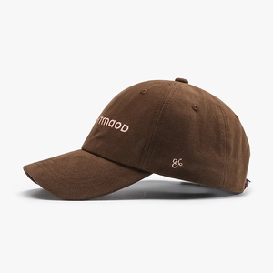 Dark brown cotton baseball cap with pink TMOOD embroidery shown from a 45-degree angle