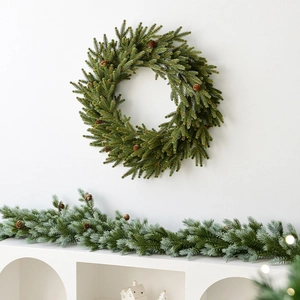 Classic green Christmas wreath and garland set with natural pine cones for holiday decor