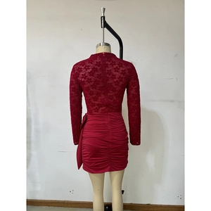 Back view of wine red lace long sleeve dress with ruched hem and zipper detail