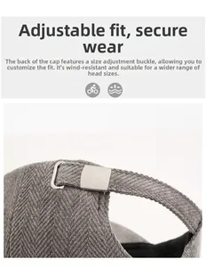 Detail of adjustable metal buckle and grey herringbone fabric on the baseball cap