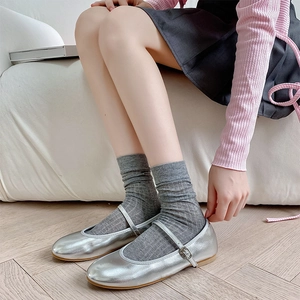Detailed shot of silver Mary Jane flats with grey ribbed socks and Japanese style outfit