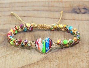 Detail of handmade imperial stone heart bracelet with bohemian braided adjustable cord