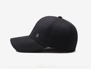 Side view of black twill baseball cap showing minimalist square logo and curved brim