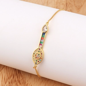 Detailed view of adjustable gold evil eye bracelet with colorful rainbow zircon stones