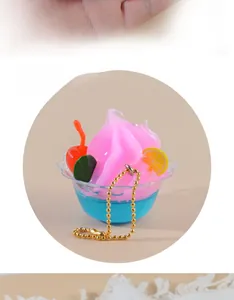 Detail of miniature pink cream sundae keychain with cherry, lemon and golden bead chain