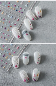 Detail of bohemian nail art stickers featuring dreamcatchers, tassels and lace patterns