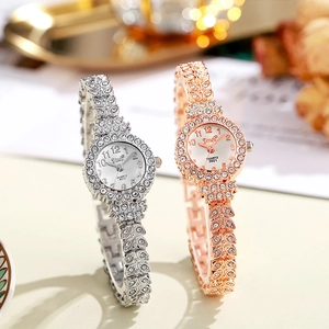 Detailed macro shot of silver and rose gold quartz watches with crystal leaf bracelets