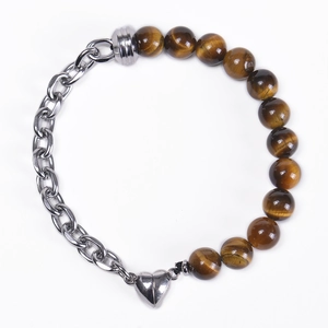 Detail of tiger eye bead bracelet with silver chain and magnetic heart charm closure