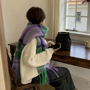 Thick rainbow plaid scarf with tassels, soft mohair style for winter warmth on model