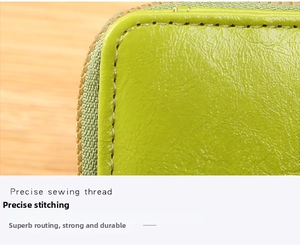 Detail of precise stitching on neon green lychee grain faux leather wallet for women